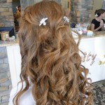 long hair curled with two pins holding sections of hair back